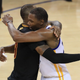 Kevin Durant of the Golden State Warriors hugs LeBron James (left) of the Cleveland Cavaliers after defeating the Cleveland Cavaliers 129-120 in Game 5 to win the 2017 NBA Finals at the Oracle Arena in Oakland, Calif., on June 12, 2017. (Ronald Martinez/Getty Images)